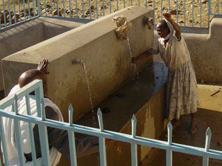 villagers enjoy their new fresh clean water supply